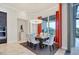 Bright dining area with a modern chandelier and access to outdoor patio at 1371 Grebe Dr, Punta Gorda, FL 33950