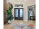 Bright entryway with double doors and stone accent wall at 1371 Grebe Dr, Punta Gorda, FL 33950