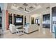 Spacious living room with coffered ceiling, large TV, and access to pool at 1371 Grebe Dr, Punta Gorda, FL 33950