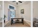 Home office with built-in shelving and large window providing natural light at 1371 Grebe Dr, Punta Gorda, FL 33950