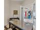 Spacious home office with glass doors, offering a view of the living room at 1371 Grebe Dr, Punta Gorda, FL 33950