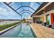 Inviting swimming pool with a view of the canal and surrounding landscape at 1371 Grebe Dr, Punta Gorda, FL 33950