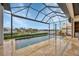 Relaxing pool area with screened enclosure and canal views at 1371 Grebe Dr, Punta Gorda, FL 33950