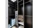 Large walk-in closet with built-in shelving and safe at 1371 Grebe Dr, Punta Gorda, FL 33950