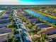 Aerial view of a community with houses and a lake at 13836 Alafaya St, Venice, FL 34293