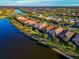 Aerial view of community with lake at 13836 Alafaya St, Venice, FL 34293