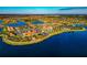 Aerial view of community with clubhouse and lake at 13836 Alafaya St, Venice, FL 34293