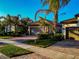 Row of houses with two-car garages and tropical landscaping at 13836 Alafaya St, Venice, FL 34293