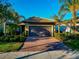 One-story home with a two-car garage and landscaped yard at 13836 Alafaya St, Venice, FL 34293