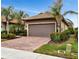One story home with two car garage and brick paver driveway at 13836 Alafaya St, Venice, FL 34293