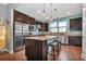 Spacious kitchen featuring stainless steel appliances and granite island at 13836 Alafaya St, Venice, FL 34293