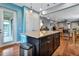 Open kitchen with granite island and access to outdoor patio at 13836 Alafaya St, Venice, FL 34293