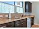 Kitchen area with granite countertops and stainless steel sink at 13836 Alafaya St, Venice, FL 34293