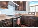 Modern kitchen with stainless steel range and granite countertops at 13836 Alafaya St, Venice, FL 34293