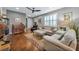 Light and bright living room with hardwood floors and a cozy seating area at 13836 Alafaya St, Venice, FL 34293