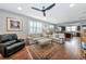 Spacious living room with hardwood floors and an open floor plan at 13836 Alafaya St, Venice, FL 34293
