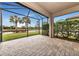Relaxing screened patio with lake and landscape views at 13836 Alafaya St, Venice, FL 34293