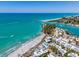 Aerial view of beachfront property and coastline at 1555 Tarpon Center Dr # 238, Venice, FL 34285
