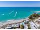 Aerial view of beachfront property and coastline at 1555 Tarpon Center Dr # 238, Venice, FL 34285