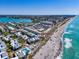 Aerial view of beachfront property and coastline at 1555 Tarpon Center Dr # 238, Venice, FL 34285