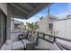 Relaxing balcony with outdoor seating and partial ocean view at 1555 Tarpon Center Dr # 238, Venice, FL 34285