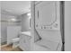 Bathroom with a walk-in shower, modern toilet and vanity with storage at 1555 Tarpon Center Dr # 238, Venice, FL 34285