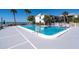 L-shaped swimming pool with surrounding patio at 1555 Tarpon Center Dr # 238, Venice, FL 34285