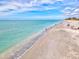 Scenic beach view featuring calm water and sandy shoreline at 1661 Columbia Dr, Englewood, FL 34223