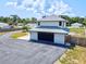 Modern two-story home with attached garage at 1661 Columbia Dr, Englewood, FL 34223