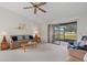 Living room with sliding glass doors leading to a patio at 1700 Curry Ave # 37, Nokomis, FL 34275
