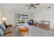 Bright living room with comfy seating, access to a patio, and lots of natural light at 1700 Curry Ave # 37, Nokomis, FL 34275