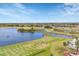 Aerial view of driving range and lake at 173 Padova Way # 17, Nokomis, FL 34275