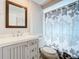 Clean bathroom, shower, toilet, and vanity with sink at 18 Oakwood N Dr # 18, Englewood, FL 34223