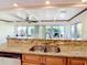 Eat-in kitchen with granite counters and stainless steel appliances at 18 Oakwood N Dr # 18, Englewood, FL 34223