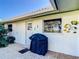 Outdoor patio area with grill and access to kitchen at 18 Oakwood N Dr # 18, Englewood, FL 34223