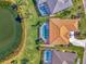 Bird's-eye view of home with pool and pond at 1815 Killdeer Ct, Venice, FL 34293