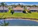 Aerial view showcasing home's pool and pond location at 1815 Killdeer Ct, Venice, FL 34293