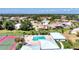 Community overview featuring pool, tennis court, and residential homes at 1815 Killdeer Ct, Venice, FL 34293