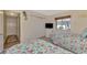Guest bedroom with twin beds, and floral bedding at 1815 Killdeer Ct, Venice, FL 34293