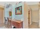 Small breakfast bar with a unique piece of art at 1815 Killdeer Ct, Venice, FL 34293
