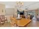 Spacious dining room with a wooden table and view of living room at 1815 Killdeer Ct, Venice, FL 34293