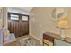 Inviting entryway with double doors and built-in bench at 1815 Killdeer Ct, Venice, FL 34293