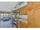 Modern kitchen with stainless steel appliances and wood cabinets at 1815 Killdeer Ct, Venice, FL 34293