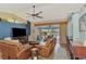 Spacious living room with leather sofas and lake view at 1815 Killdeer Ct, Venice, FL 34293