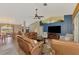 Spacious living room with leather furniture and a large TV at 1815 Killdeer Ct, Venice, FL 34293