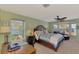 Main bedroom with king-size bed and water views at 1815 Killdeer Ct, Venice, FL 34293