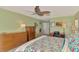 Main bedroom with king-size bed and access to the bathroom at 1815 Killdeer Ct, Venice, FL 34293