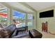 Relaxing sitting area with leather seating and pool view at 1815 Killdeer Ct, Venice, FL 34293