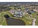 Aerial view of community with golf course and clubhouse at 1891 San Silvestro Dr, Venice, FL 34285