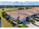 Community of tan houses with tile roofs near golf course at 1891 San Silvestro Dr, Venice, FL 34285